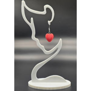 pair of heart earrings on display stand